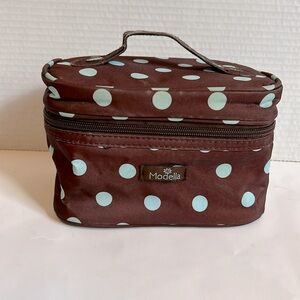 Modella small cosmetic case.  Brown with blue polka dot print.